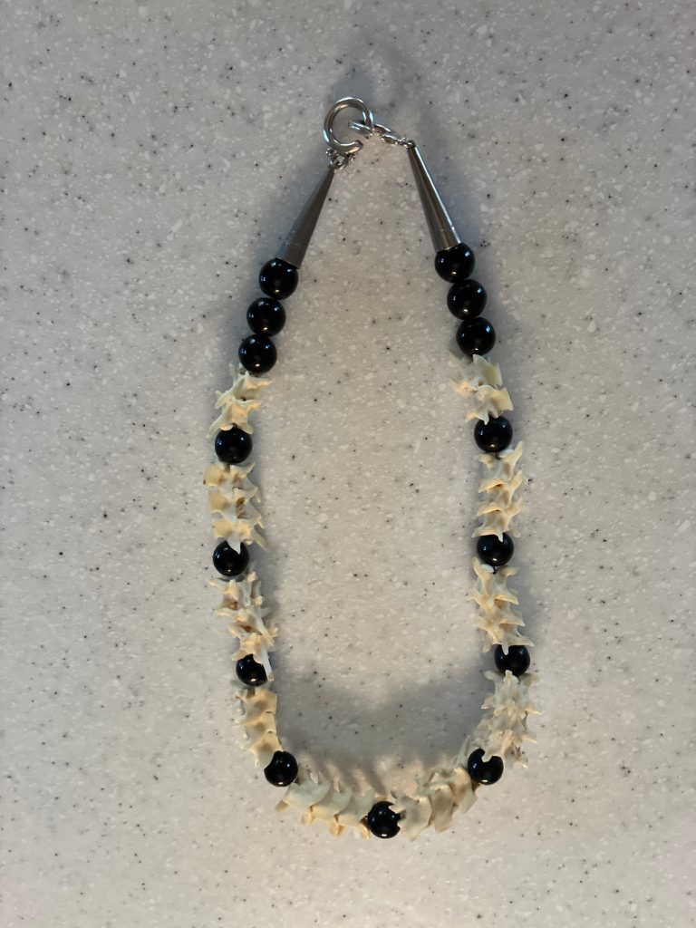 Catherine Reidy's Rattlesnake Necklace with vertebrae and black beads