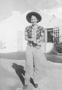 Betty Procter in a Hat in Front of Procter-Leiber House.