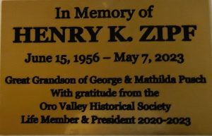 Henry K. Zipf memorial plaque on bench outside of Pusch House Museum