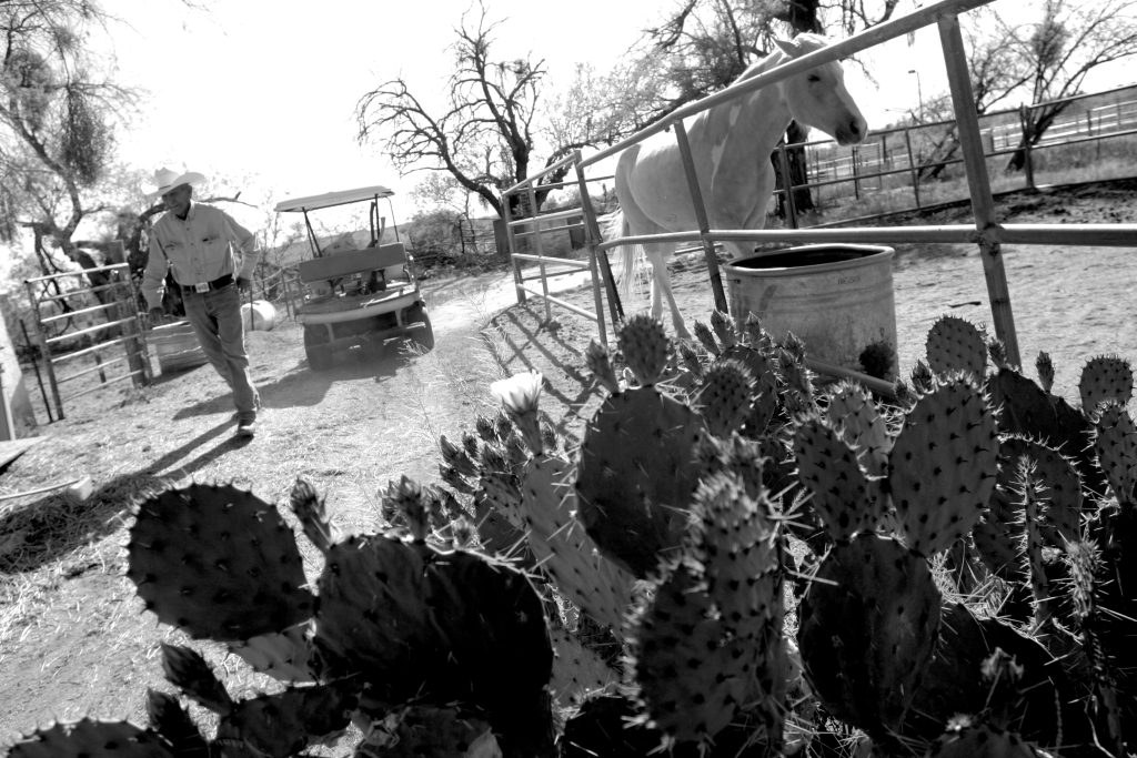 Carlos Rivera by Corral at Steam Pump Ranch with Golf Cart April 2008, by Randy Metcalf