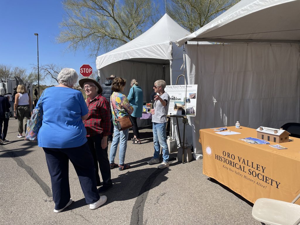 Tina Zogott (in red) and Devon Sloan share the OVHS mission with visitors at the SAACA Spring 2025 event.
