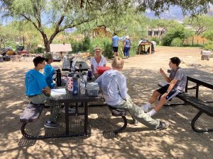 Four boys from Troop 299, Oro Valley Catalina Council Scouting America Planting Native Trees at Steam Pump Ranch August 2025 at Tables with Joyce Rychener