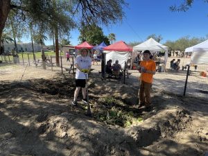 Two men standing in compost bin at United Way Days of Caring at Heritage Garden_October 2025