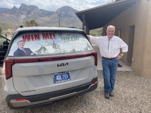 OVHS President, Bob Kellar, leaning against the 2025 Jim Click Raffle Car
