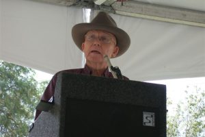 Jim Kriegh Speaking Behind Podium Outdoors