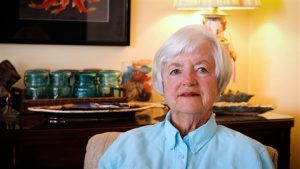 Twink Monrad in Living Room wearing a bright blue shirt in 2024