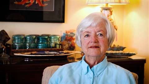 Twink Monrad in Living Room wearing a bright blue shirt in 2024