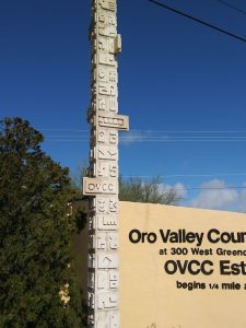 Oro Valley Country Club Entrance Sakellar and Savage Sculpture. Tall like a totem pole.