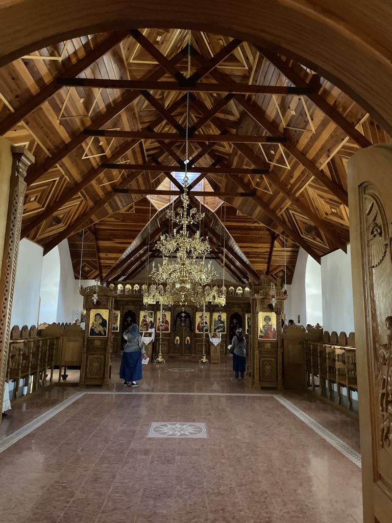St. Anthony's Greek Orthodox Monastery Interior of a Building with arched wooden beams, March 2025, Florence, AZ.
