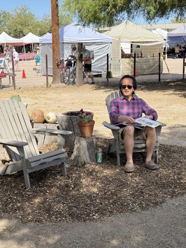 Garden Volunteer Huy Nguyen Relaxing in Adirondack Chair, April 2026