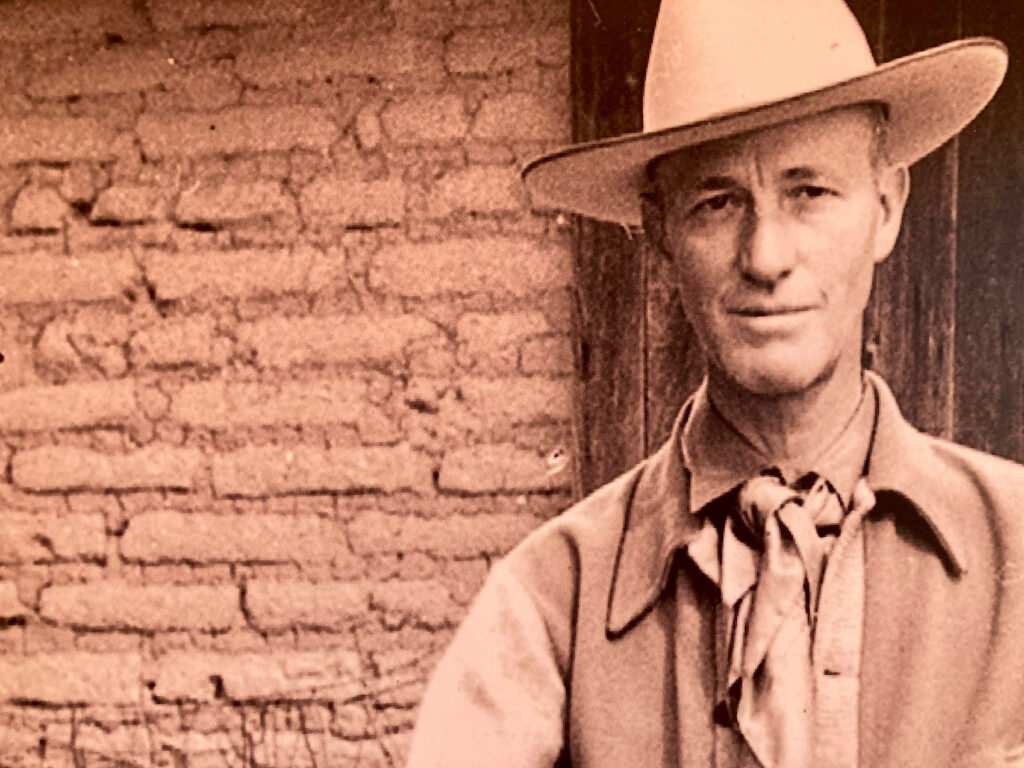 Jack Procter in Cowboy Hat and western shirt, tie and vest
