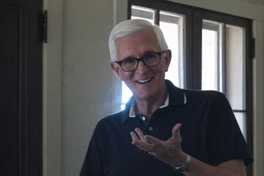 Jim Williams smiling in a dark golf shirt