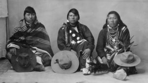 Tohono O'odham People Sitting on the ground