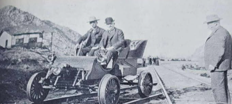 Silver Bell Red Rock Men in Car on Tracks